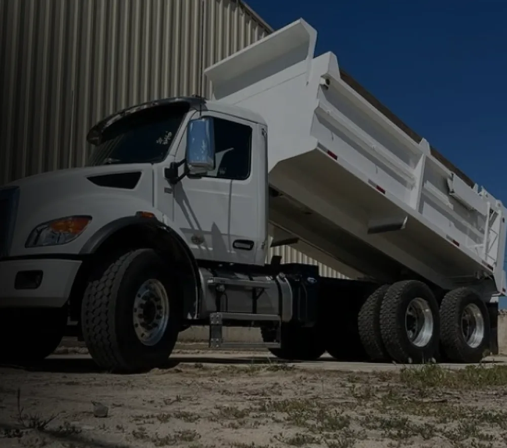 A finished Assembly Industrial truck body on a completed chassis outside the shop.